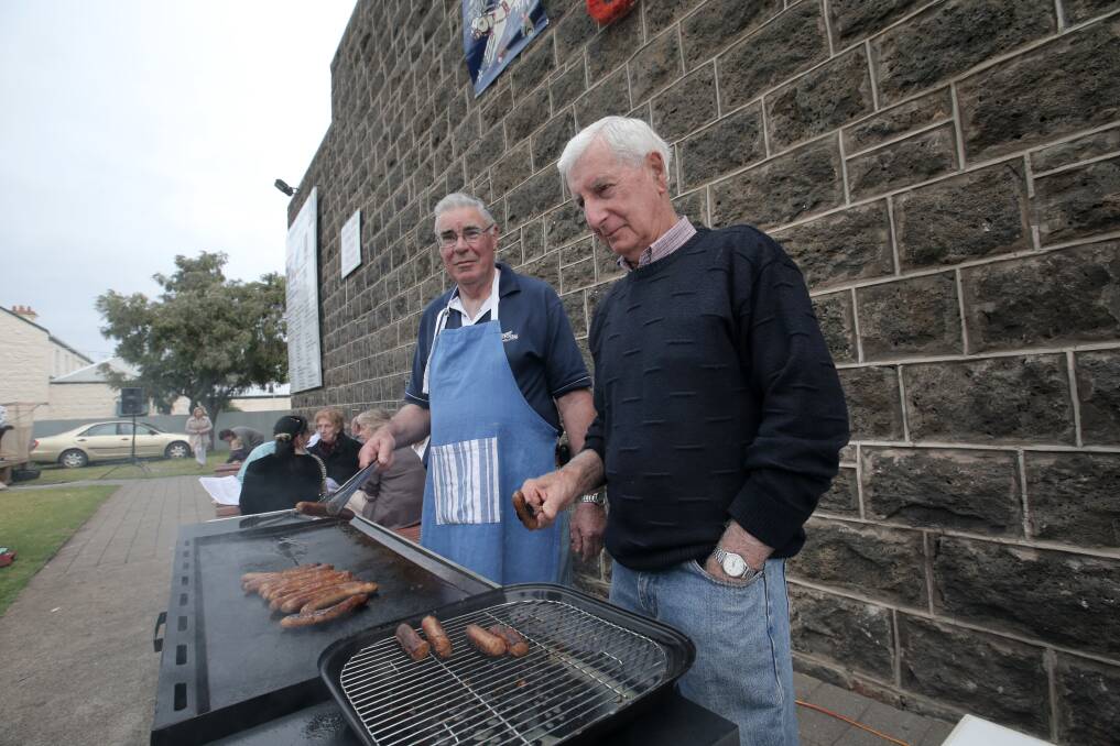 Bruce Warton, and Ken Adamson work the barbecue.