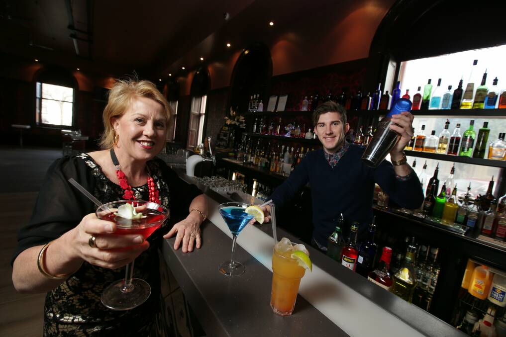 Cancer survivor Helen Keegan with Gallery Nightclub manager Alister Porter, with a couple of cocktails raising money for Peter's Project. Picture DAMIAN WHITE