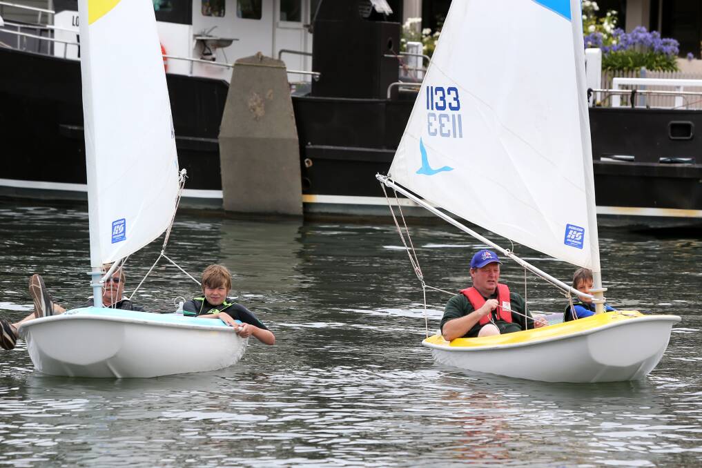 Darrel Cairns, of Port Fairy (left), William Taylor, 13, of Melbourne, David Massey, of Port Fairy, and Lachlan Jackson, 10, of Melbourne, have a go at sailing on the Moyne River.