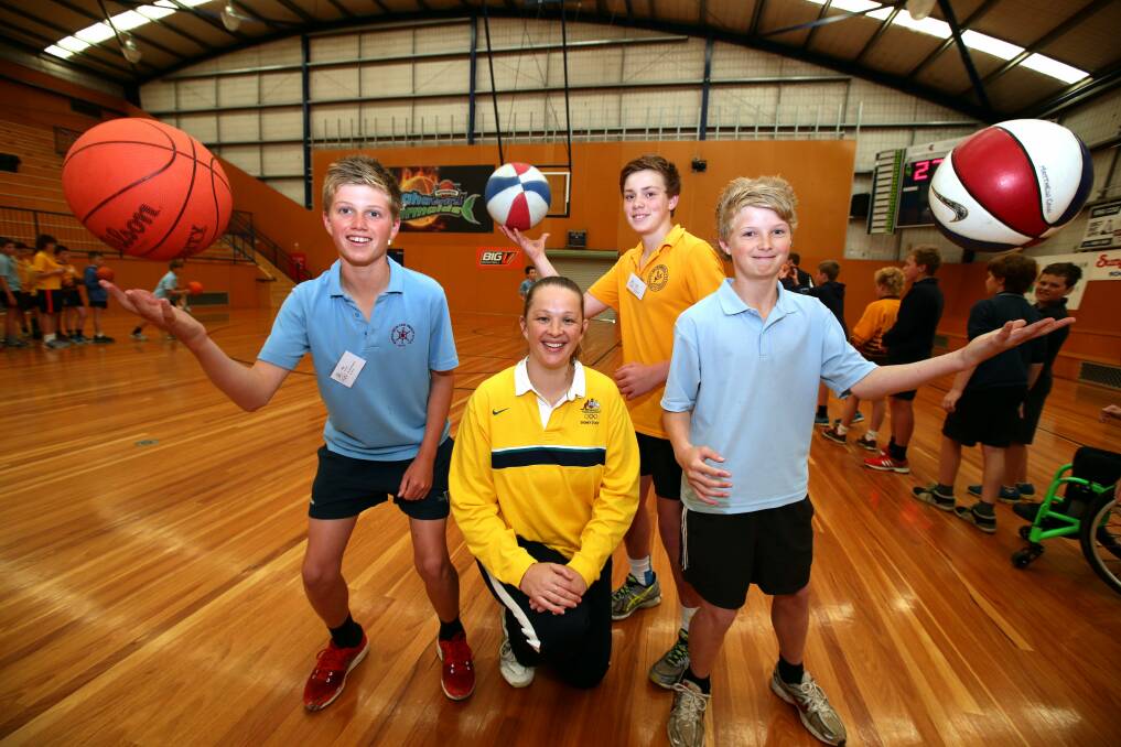 Olympian Michelle Brogan with Jay Rantall, 12, from Warrnambool East Primary, Isaac Thomas, 12, from Warrnambool Primary school, and Will Timms, 13, from Merrivale Primary School.