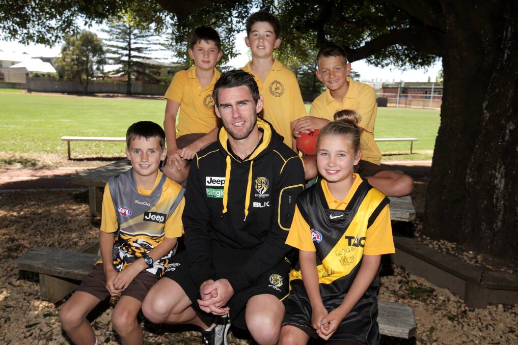 Former Richmond AFL captain Chris Newman with Warrnambool Primary School grade 6 students and passionate Richmond fans (back l-r) Flynn Herrman, 12, Fraser Marris, 12, Xavier Mitchem, 12, (front l-r) Ryan Fleming, 11, and Rorie Graham, 11, as part of the club's Community Camp in Warrnambool.