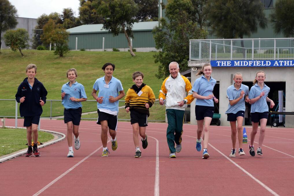 Trevor Vincent runs at Brauander Athletic Park with Ollie Bridgewater, 12, Jye Brown, 12, both from Warrnambool East Primary, Horizon Moore, 13, from Merrivale Primary, Kaide Walker, 13, from Warrnambool Primary, Esther Trewin, 12, from East Warrnambool Primary, Ashlea Ferguson, 12, from Merrivale Primary and Shona Noske-Poulton, 12, from East Warrnambool Primary.
