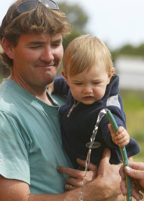 Paul Essing, pictured with son Brody, aged one, is concerned about the water quality at Allansford.