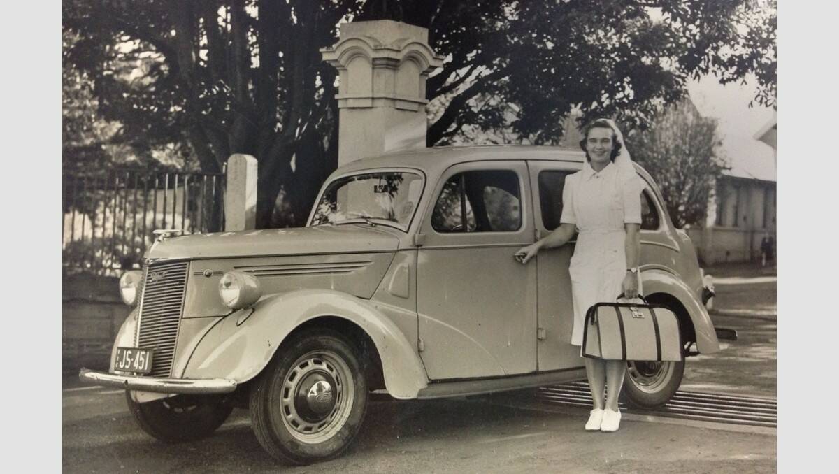 Audrey Coleman (later Anderson) was Warrnambool’s first visiting nurse, posing here in 1947 at the base hospital gates in front of a Ford Prefect.