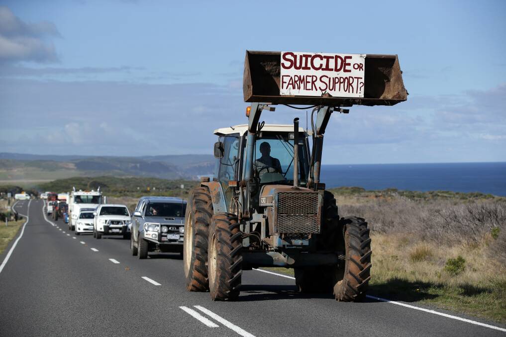 Farmer Power protesters rallied at the Twelve Apostles then took a slow drive in tractors and utes to Port Campbell along the Great Ocean Road. 
