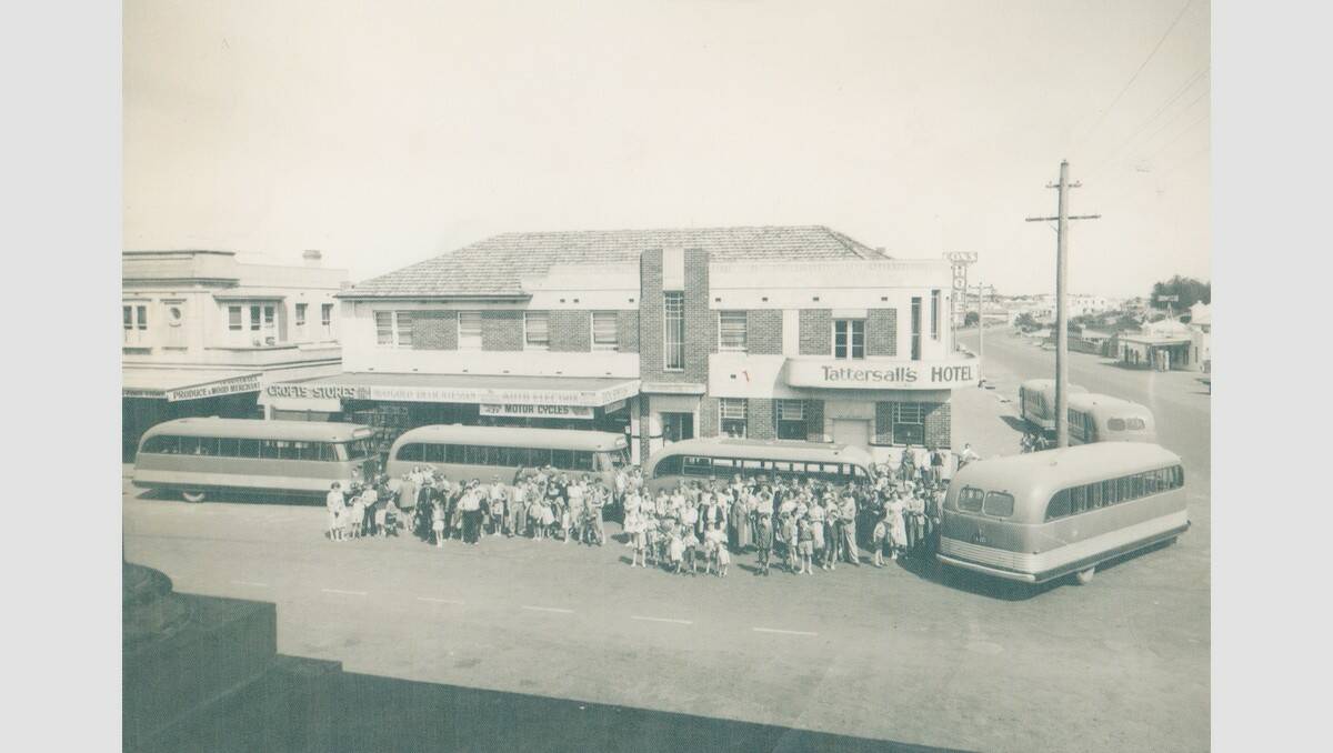 Bus groups from the mid-50s to 1960 period gather outside the Tattersalls Hotel, known for its familiar art deco shape on the corner of Liebig Street and Raglan Parade. The site is now the location of McDonald's. SOURCE: Warrnambool & District Historical Society.
