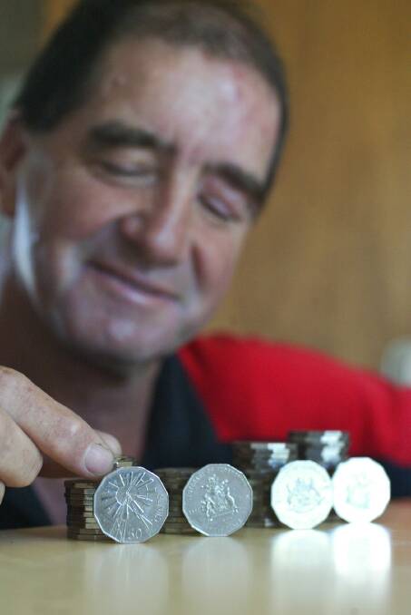 Eric Hansford from Noorat with 2002 50 cent coins from his collection.