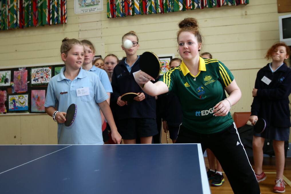 Table Tennis Olympian Sarah Lazzaro showing some skills to Warrnambool East Primary Millie Quarrell, 12, at Warrnambool Primary school.