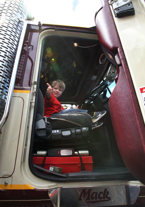 Harry Haylock, 3, from Port Fairy tries out at a Mack truck owned by Boyles Livestock in Mepunga.