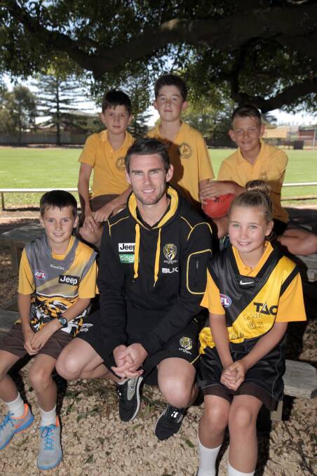 Former Richmond AFL captain Chris Newman with Warrnambool Primary School grade 6 students and passionate Richmond fans (back l-r) Flynn Herrman, 12, Fraser Marris, 12, Xavier Mitchem, 12, (front l-r) Ryan Fleming, 11, and Rorie Graham, 11, as part of the club's Community Camp in Warrnambool.