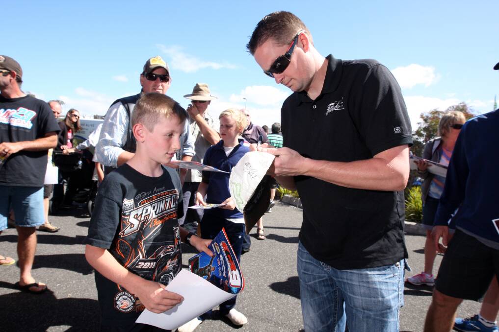 Lachlan Cox, 9, from Adelaide with driver Jason Meyers. Picture: AARON SAWALL