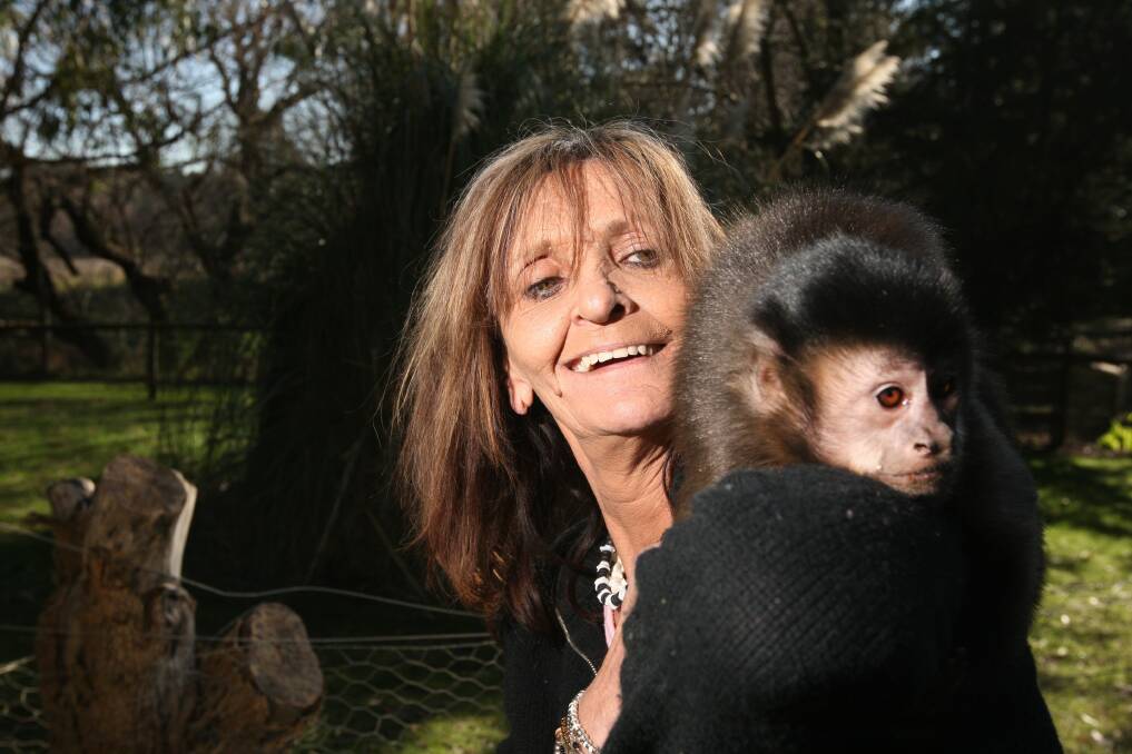 Cudgee Wildlife Park is closing after 20 years, pictured is owner Helen Altmann with Jay the monkey. 