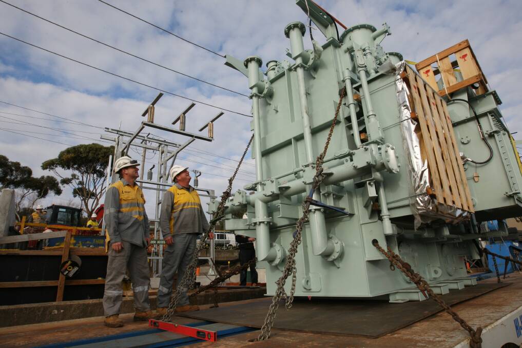 Electrical plant and test workers Brett Harte and Stuart Noughton installing a new transformer at Warrnambool's substation. Picture: VICKY HUGHSON
