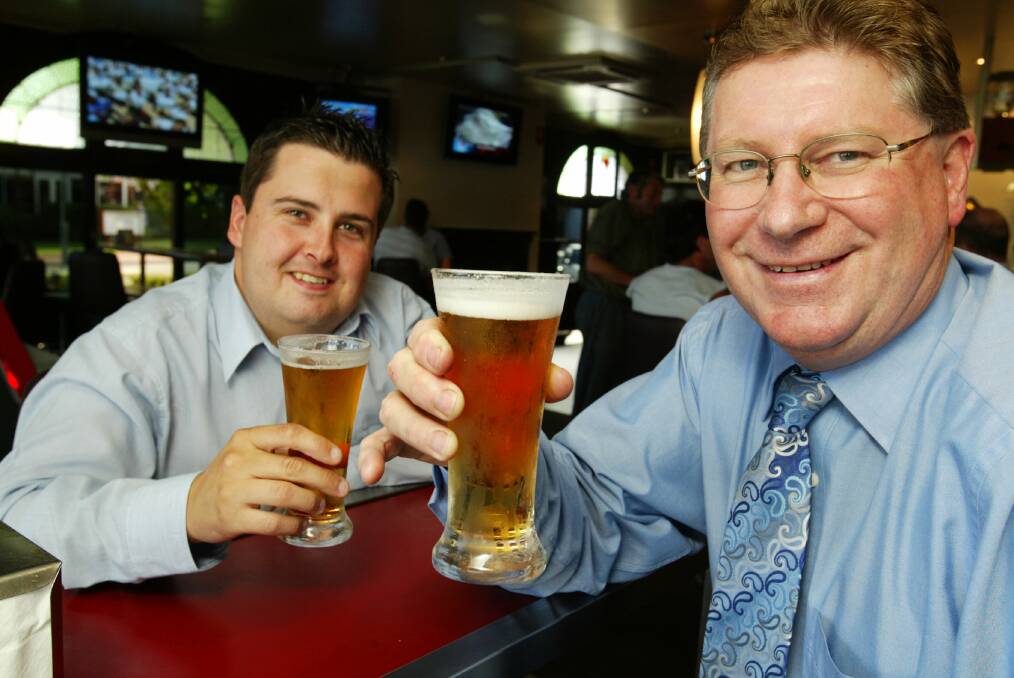 Denis Napthine enjoys a frothy with colleague Nathan Anderson.
