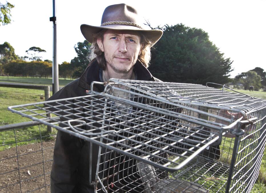Lester Byrne with his cat trap says bounties are the answer to many problems with feral cats.