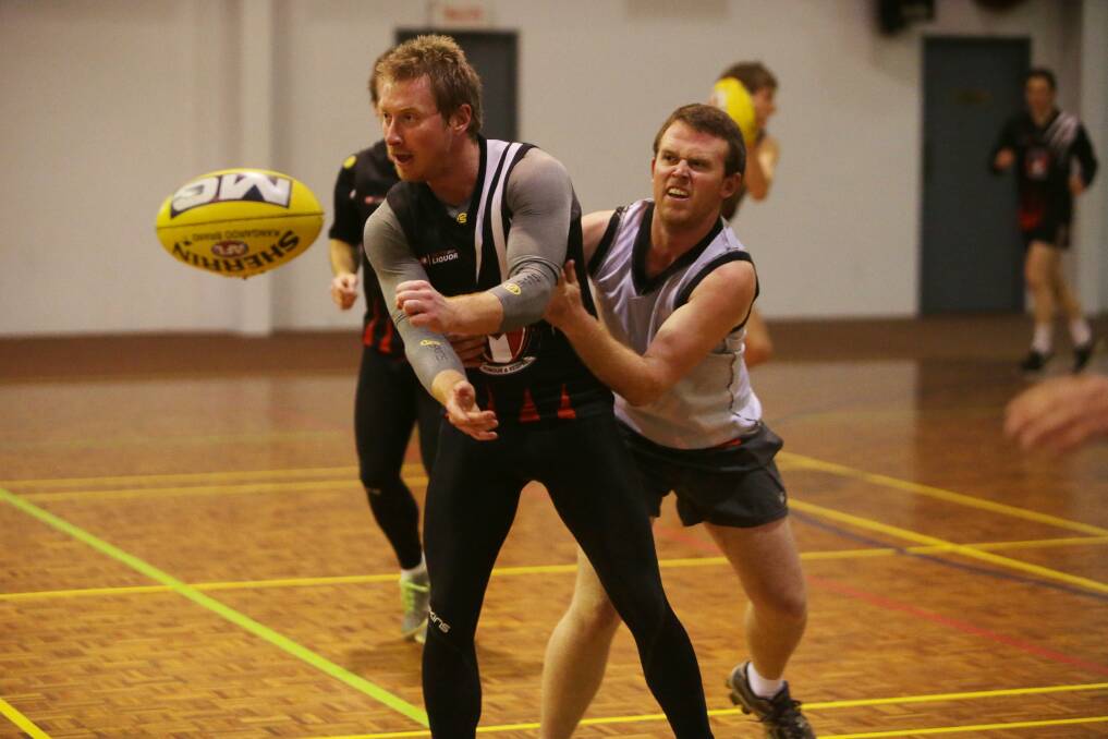 Tim Carter and Sam McElgunn at Koroit's football training indoors. Picture: AARON SAWALL
