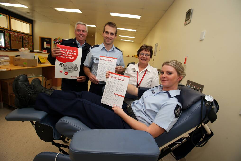 Senior Sergeant Shane Keogh, First Constable Nick Roberts, Warrnambool donor centre manager Ann Barker, Constable Ashlea Witham gave blood for the lead up to the June long weekend.