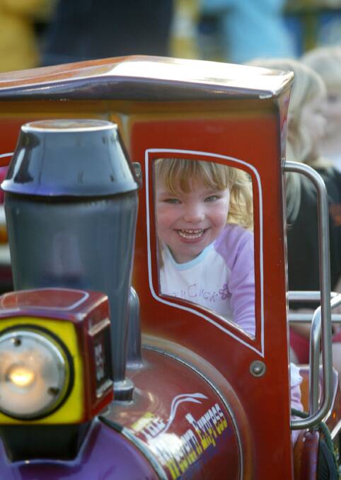 Riding on 'the Western Express' carnival ride is Renee McKenzie, 3, from Melbourne, Friday evening at Lake Pertobe.