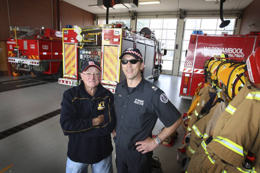 Warrnambool CFA veteran Mick Corbett (left) and Warrnambool station officer Greg Kinross reflect on the Telstra exchange fire and the risks it posed for firefighters.