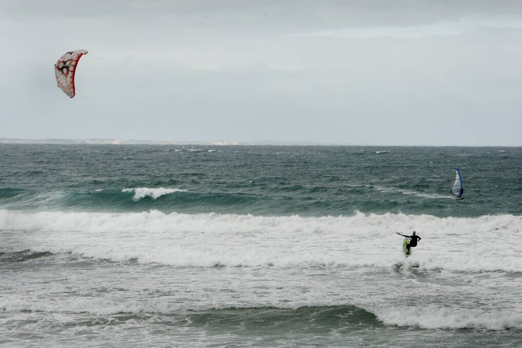 A kitesurfer enjoys the waves at Port Fairy's East Beach.