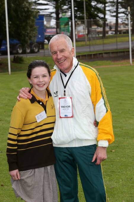 Distance runner at 1964 Olympics Trevor Vincent with his granddaughter Kate Vincent, 12, from Warrnambool Primary school. Picture: DAMIAN WHITE