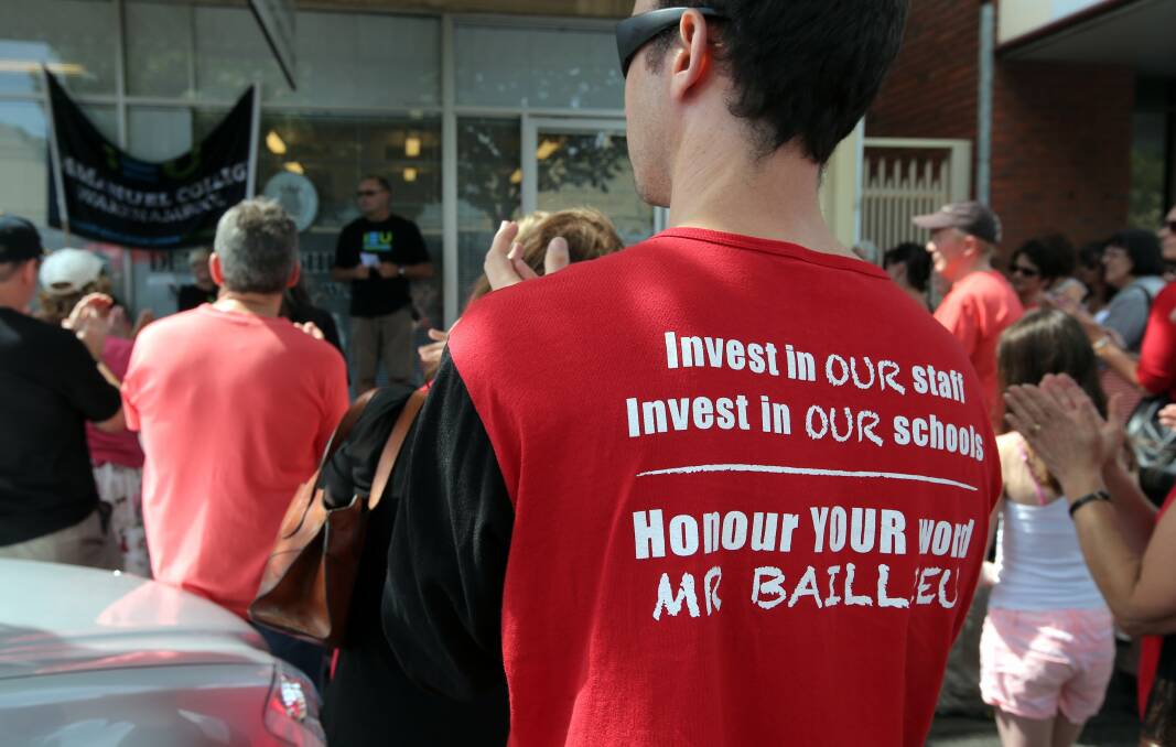 Teachers rally on Liebig Street yesterday outside MP Denis Napthine's office.