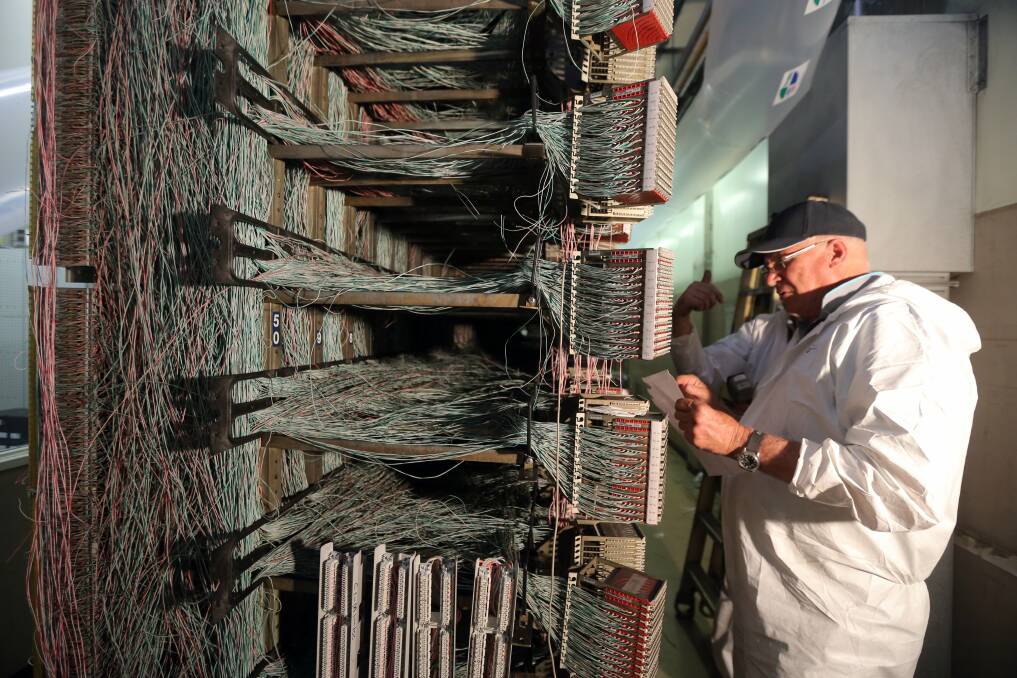 Telstra technicians working the Main Distribution Frame, which holds 30,000 connections.