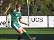 ROCK SOLID: Port Fairy's Harry Parrett passes the ball out of defence for Bentleigh Greens. Picture: Con Balatsas