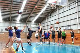 NBL superstar Mitch Creek overseeing a drill with Terang junior basketballers. Picture by Anthony Brady