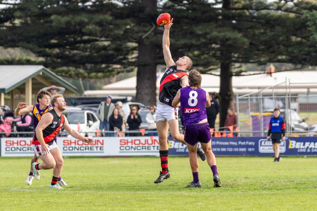 Tim Auckland leaps for a hit-out against Port Fairy. Picture by Eddie Guerrero