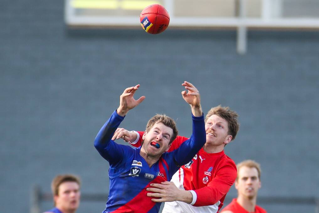 Liam Mullen punches the ball from behind last season. File picture