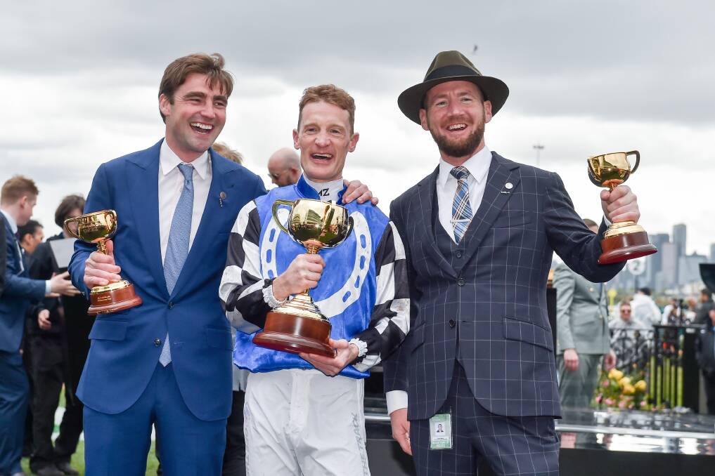 Trainer David Eustace, jockey Mark Zahra and trainer Ciaron Maher celebrate Gold Trip's win in the Melbourne Cup. Picture by Getty Images