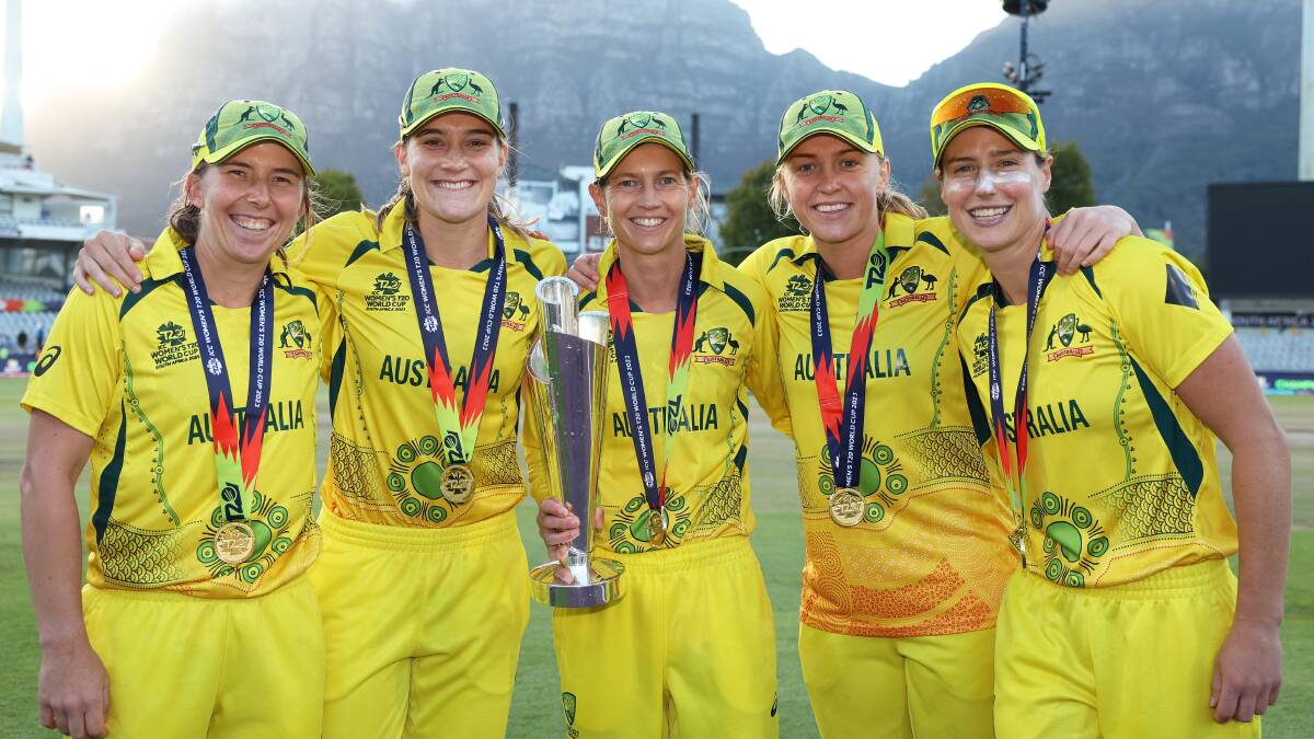 Georgia Wareham (left) poses with her teammates after winning the 2023 ICC Women's T20 World Cup. Picture by Getty Images