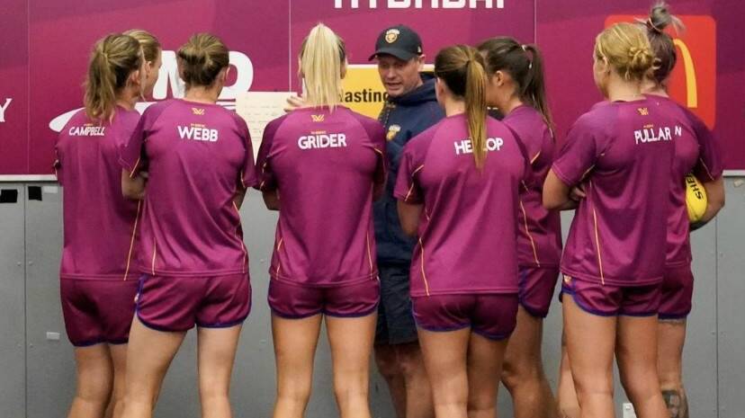 Terang export and Brisbane Lions AFLW defensive coach Paul Henriksen speaks to his back line ahead of a game. Picture by Brisbane Lions Media