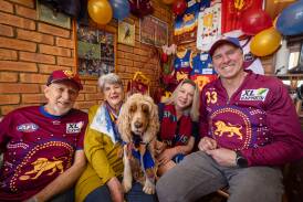 Bill Bailey, Meredith Bailey, Jorgie Sarahs, Brent Bailey and Chai the dog will be supporting Brisbane Lions forward Zac Bailey in Saturday's AFL grand final. Picture by Sean McKenna.