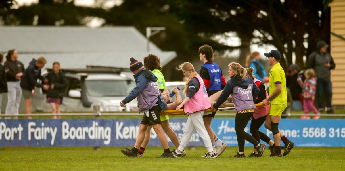 TREATMENT: McVilly had to be stretchered off against Port Fairy. Picture: Chris Doheny