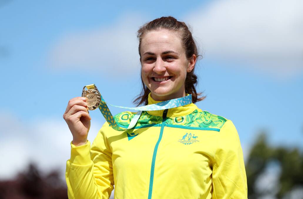 Camperdown's Grace Brown shows off the spoils after winning the Commonwealth Games women's time trial. Picture by Getty Images