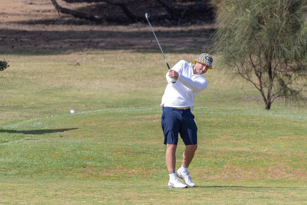 Ben Cunnington targets the green on a par three. Picture by Eddie Guerrero