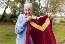Robbie Wallace with the Nirranda jumper he won a premiership with in 1964. Picture by Anthony Brady