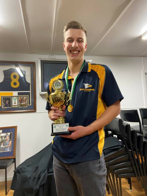 North Warrnambool Eagle Seb Shiells smiles with the Judd Cup.