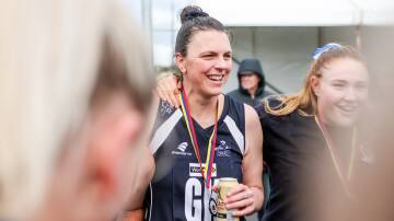 Nirranda's Lisa Anders celebrates alongside her teammates after winning the premiership on Saturday. Picture by Anthony Brady