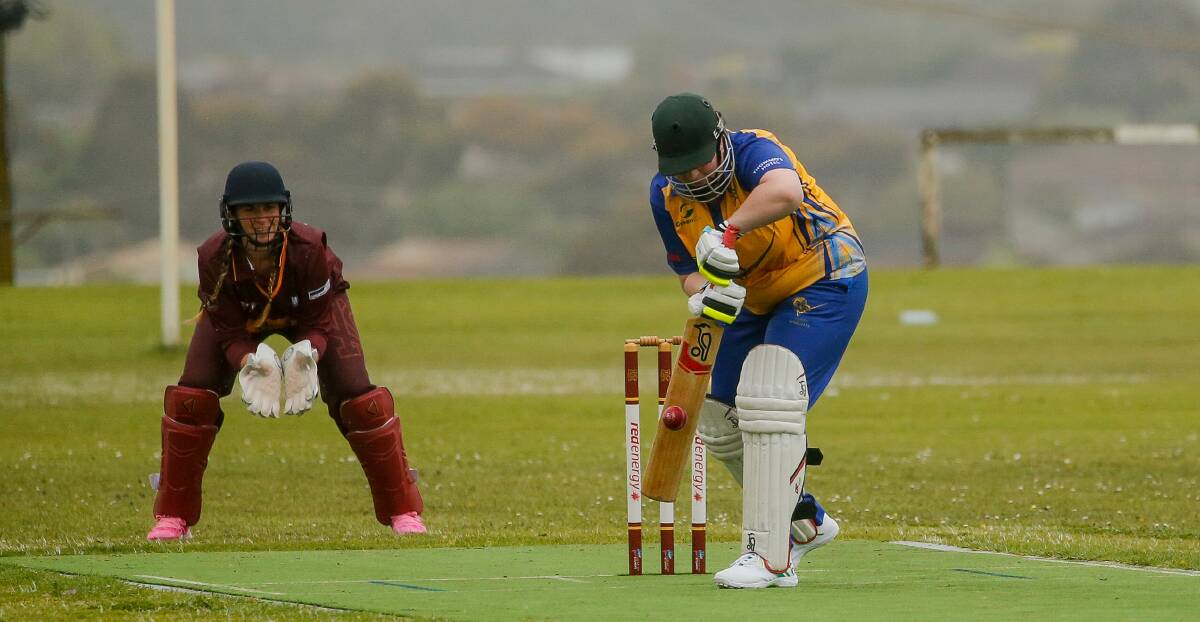 Cobden coach Ingrid Bellman defends the ball on her way to 43 not out against Nestles. Picture by Anthony Brady