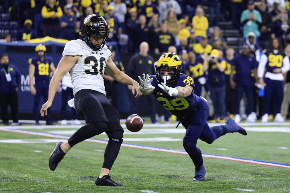 Purdue's Jack Ansell mid-punt against Michigan last season. Picture by Getty Images