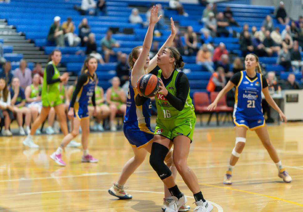 Julie Nielacna eyes the basket on debut for the Warrnambool Mermaids against Bulleen. Picture by Larry Lawson