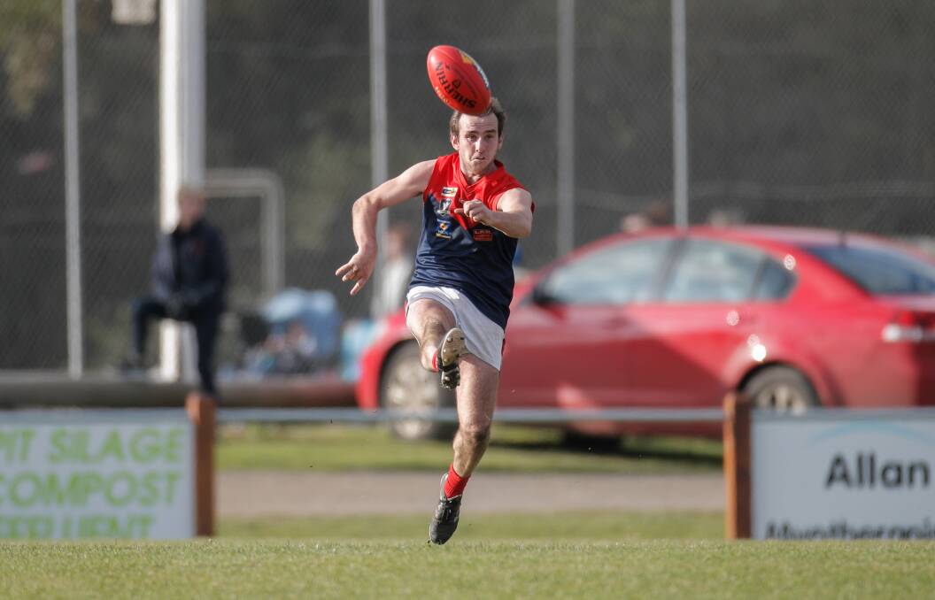 Ash Hunt kicks the ball downfield for Timboon Demons in 2017. File picture