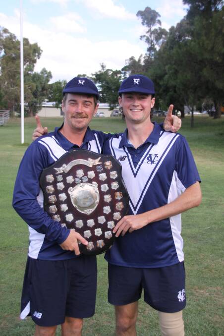 Warrnambool cricketers Cam Williams and Ethan Boyd pose with the shield after winning the National Country Cricket Championships. Picture by Victorian Country Cricket League