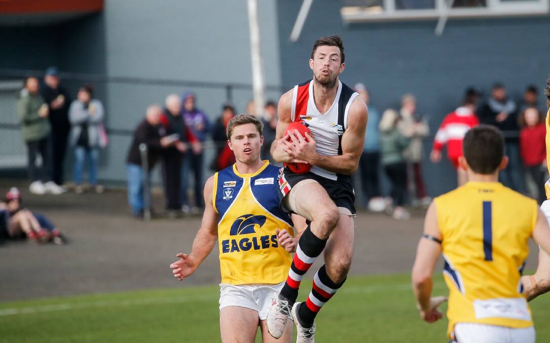 Koroit's Jeremy Hausler gets up for a nice chest-mark against North Warrnambool Eagles. Picture by Anthony Brady