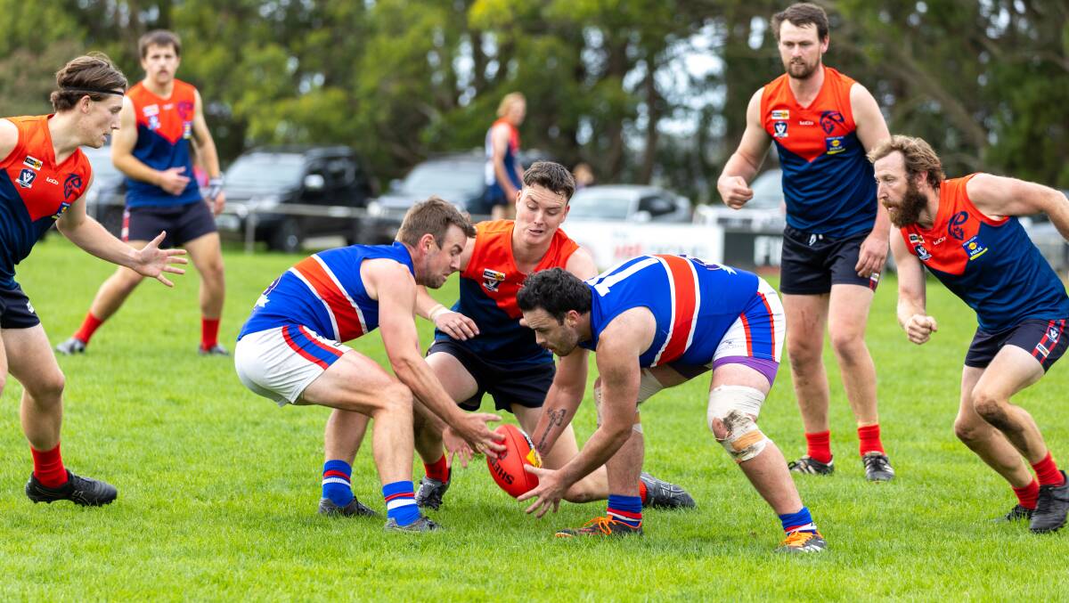 Panmure skipper Tyler Murnane (left) competes for a ground ball against Timboon Demons. Picture by Eddie Guerrero