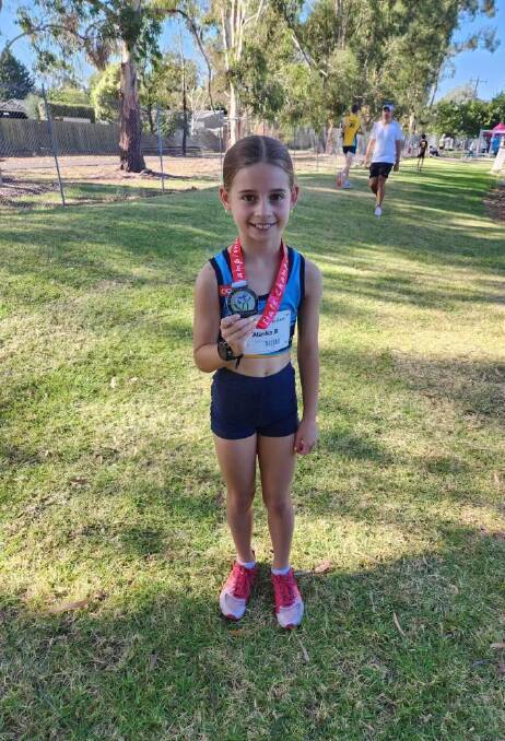 Alaska Bremner with her silver medal won in the under 10 girls 1100-metre walk. Picture supplied