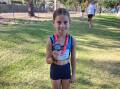Alaska Bremner with her silver medal won in the under 10 girls 1100-metre walk. Picture supplied